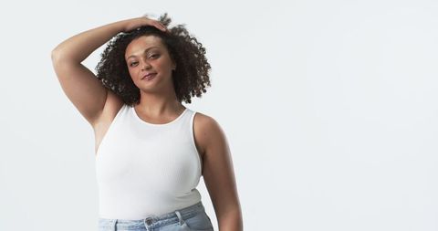Confident Plus-Size Woman Embracing Natural Hair