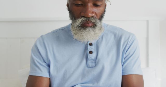 Relaxing Mature Man with Beard Focused on Reading at Home - Download Free Stock Images Pikwizard.com