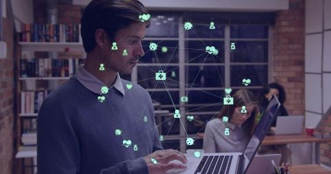 Young professional typing on laptop with network overlay visualizing remote collaboration