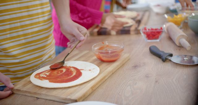 Children Preparing Homemade Pizza with Tomato Sauce - Download Free Stock Images Pikwizard.com
