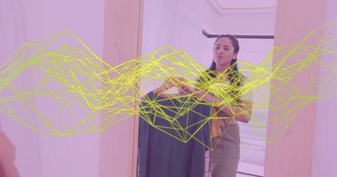 Indian woman styling outfit with futuristic wireframe display