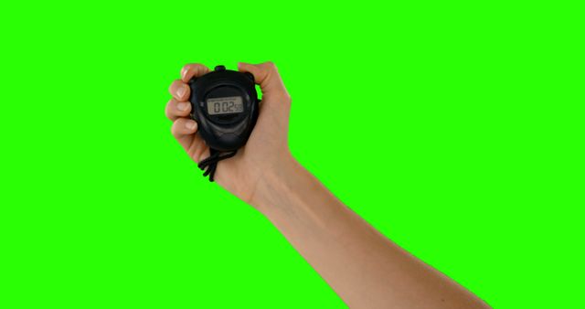 Hand Holding Stopwatch Against Green Background for Timing Concept - Download Free Stock Images Pikwizard.com