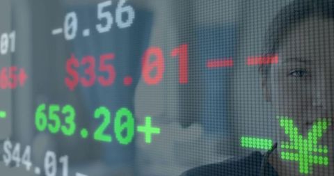 Businesswoman analyzing real-time stock ticker with futuristic led data overlay in office