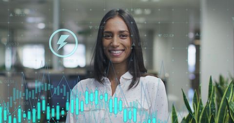 Businesswoman Overlaid with Digital Financial Graphics in Modern Office