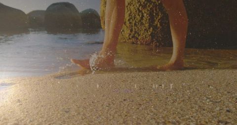 Relaxing Barefoot Walk on a Sandy Beach at Sunset
