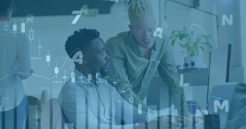 Business professionals analyzing financial data with overlay of graphs
