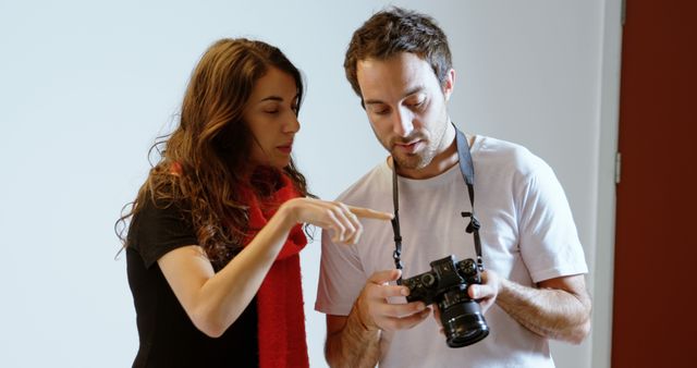 Photographer Showing Image to Female Friend During Shoot - Download Free Stock Images Pikwizard.com