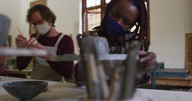 Artists Wearing Masks Creating Pottery in Studio - Download Free Stock Images Pikwizard.com