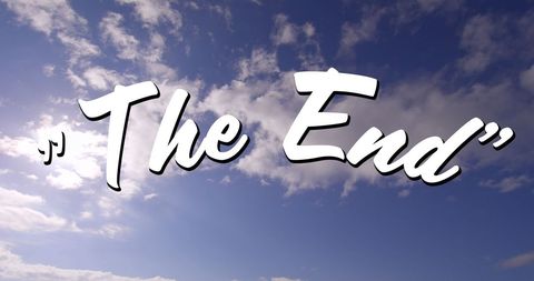 The end sign with cloudy sky background
