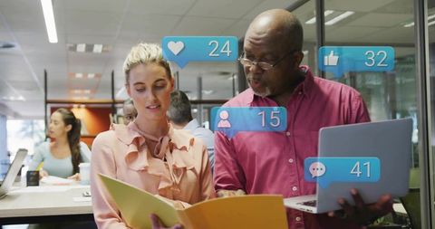 Office team collaborating over project documents with social media reactions overlay