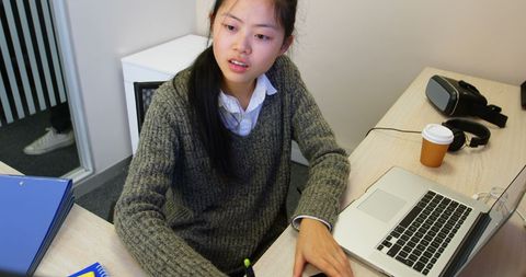 Business Professional Using Virtual Reality in Modern Office