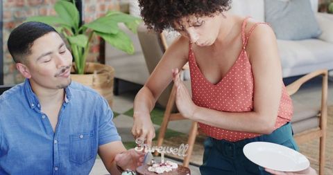 Farewell celebration with cake cutting in office setting