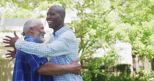 Happy African American Father and Son Hugging Outdoors - Download Free Stock Images Pikwizard.com