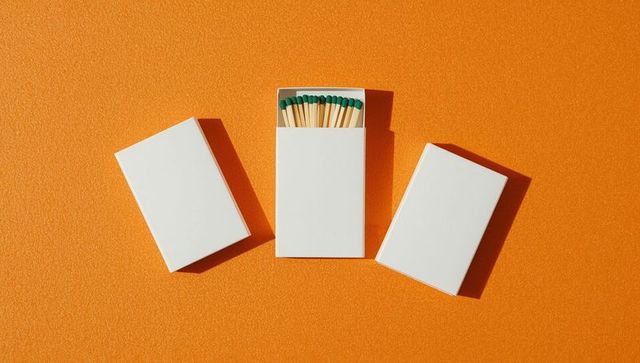 Minimalist Matchboxes on Vivid Orange Background