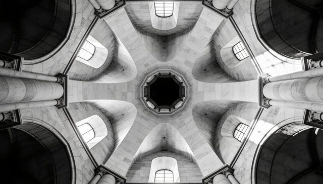 Revealing octagonal dome with ribbed vaults and neoclassical columns in black and white