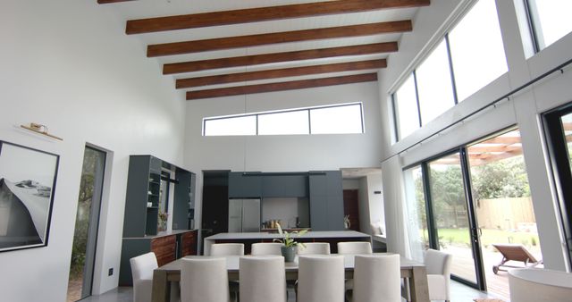 Spacious Modern Dining Room with High Ceilings and Wooden Beams - Download Free Stock Images Pikwizard.com