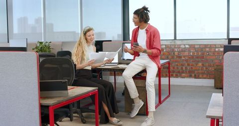 Professional Collaboration Amongst Diverse Colleagues in Modern Office