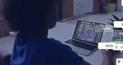 Businesswoman engaged in virtual team meeting on laptop