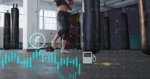Female boxer training with biometric hud overlays in industrial gym heavy bag workout