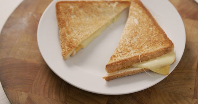 Image of freshly prepared cheese white bread sandwich on white plate. fusion food and home made snack concept.
