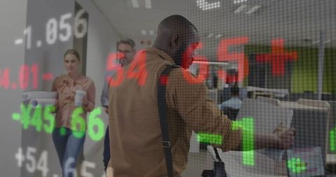 Colleagues moving office with stock market ticker overlay