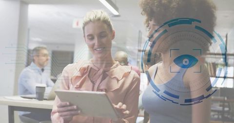 Business Professionals Explores Tablet With Digital HUD Overlay in Innovative Office Setting