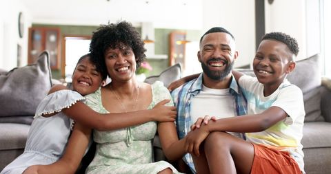 Happy Family Embracing in Cozy Living Room Setting - Download Free Stock Images Pikwizard.com