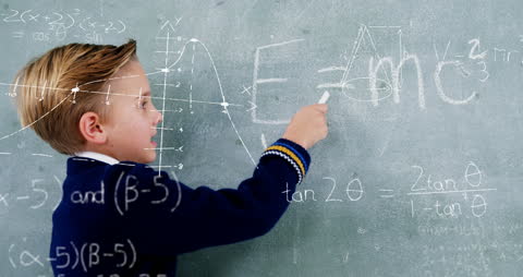 Young Student Explores Mathematics on Blackboard