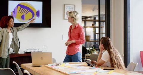 Creative Team Collaborating in Modern Conference Room on Project
