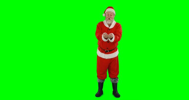 Santa Claus in traditional red and white costume stands on a green screen background, holding out Christmas presents. This can be used for holiday promotions, Christmas-themed advertisements, festive videos, or creating custom holiday greetings with Santa. The green screen allows for easy background changes.