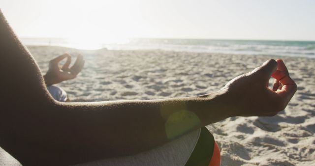 Man Meditating on Beach with Sunset in Background - Download Free Stock Images Pikwizard.com