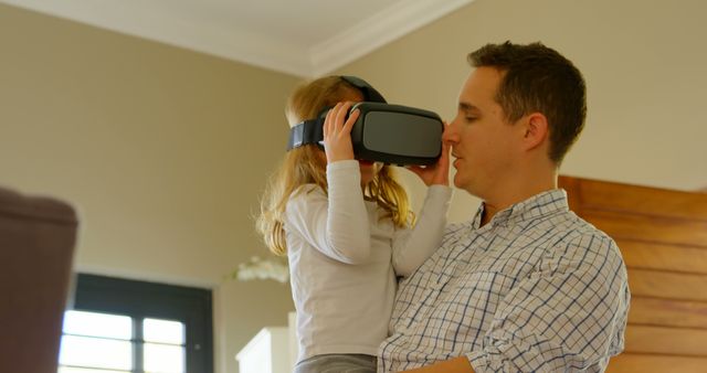Father and Daughter Sharing Virtual Reality Experience at Home - Download Free Stock Images Pikwizard.com