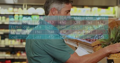 Man Studying Pineapple in Grocery Produce Section