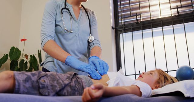 Pediatrician Examining Young Patient in Clinic - Download Free Stock Images Pikwizard.com