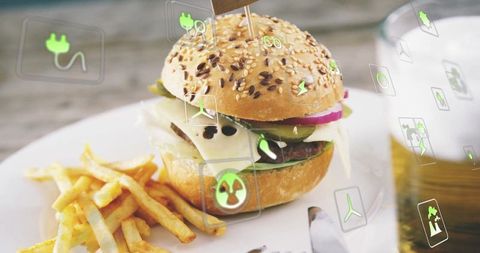 Eco-Friendly Gourmet Cheeseburger With Sustainable Icons and Beer