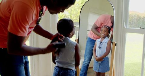 Father Bonding with Daughter through Hair Brushing Routine