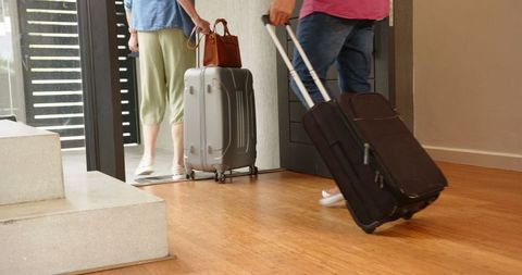 Family check-in at modern hotel with luggage