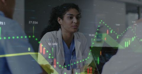 Healthcare Professional Analyzing Graph with Team for Data-Driven Decisions - Download Free Stock Images Pikwizard.com