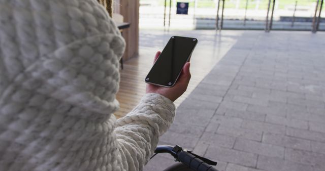 Person Using Smartphone While Riding Bicycle Outdoors - Download Free Stock Images Pikwizard.com