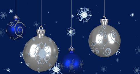 Elegant Hanging Christmas Ornaments On Blue Background