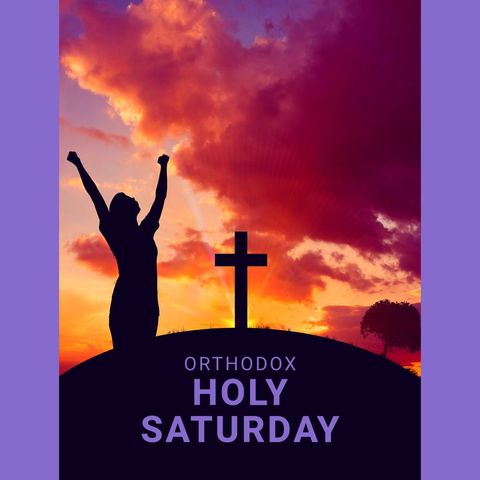 Silhouette of woman praying beside christian cross at sunset