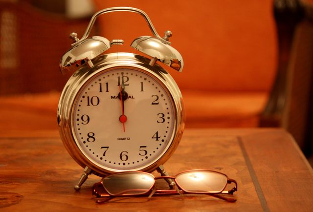 Vintage Alarm Clock and Glasses on Wooden Table - Download Free Stock Photos Pikwizard.com