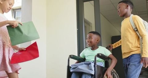 Inclusive school friendship showing diverse students helping classmate in wheelchair