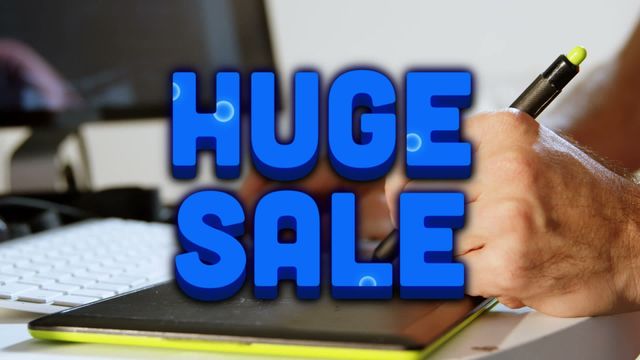 Ideal for marketing campaigns, e-commerce platform advertisements, and promoting special sales events. This stock video can be used for social media posts, banner ads, and website sliders to grab attention with a vibrant 'huge sale' text and the professional context of an individual using a graphic tablet.