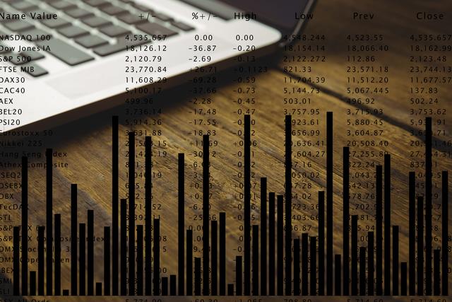 Laptop on wooden desk with stock market graph provides a visual of financial analysis. Ideal for use in business reports, investment guides, trading tutorials and financial consulting presentations. Combines technology with finance for impactful visuals.