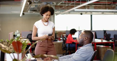 Coworkers Collaborating at Modern Office with Technology