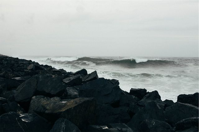 Rocky Shoreline and Crashing Waves on Overcast Day - Download Free Stock Photos Pikwizard.com