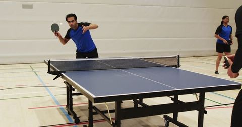Dynamic Table Tennis Match in Indoor Sports Hall
