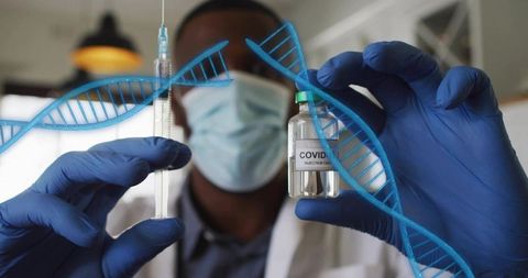 Masked doctor holding COVID vaccine vial and syringe with DNA helix overlay, blue gloves