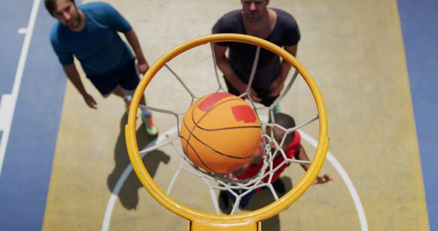 Basketball Game Viewed From Hoop with Players Waiting for Score - Download Free Stock Images Pikwizard.com